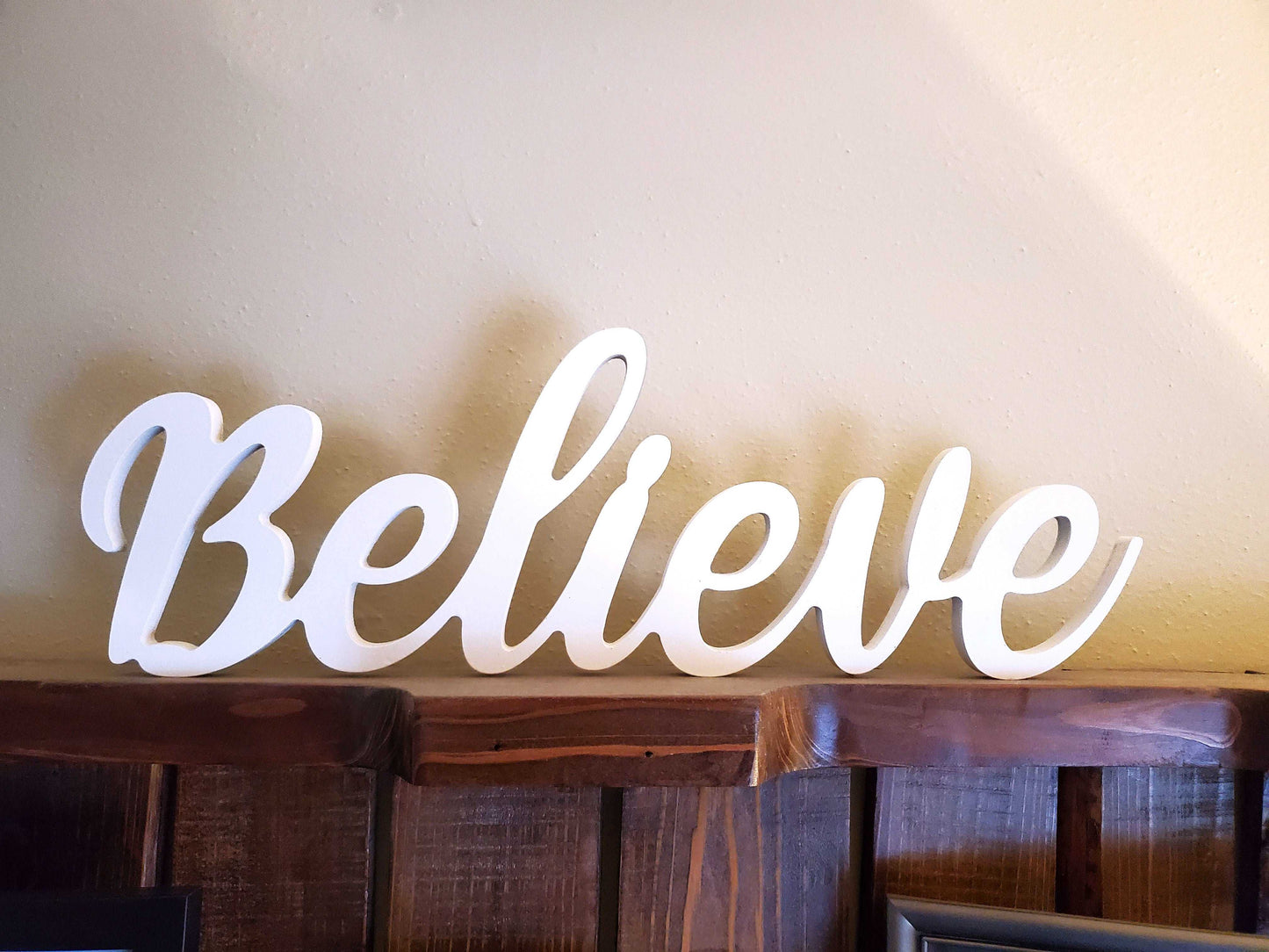 "Believe" script word cutout Christmas decoration