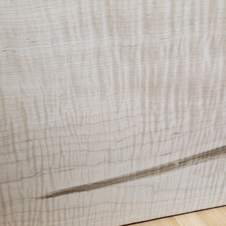 Close-up of a wooden surface with visible grain and texture